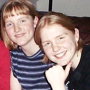 2000 - me and my sister, back when my hair behaved itself most of the time and didn't frizz up when I wore it down. I loved that blue striped shirt.
